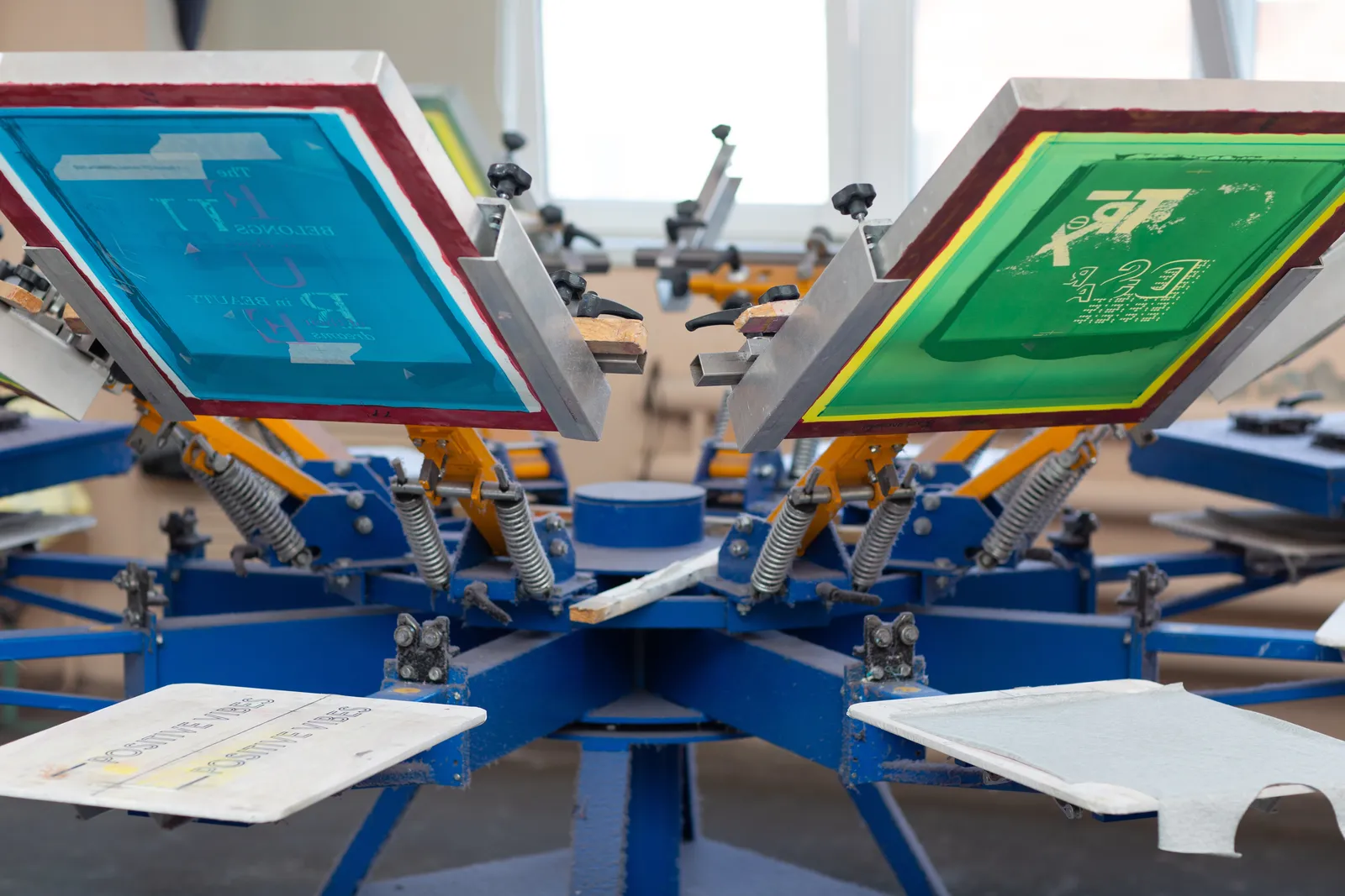 Carousel screen-printing press with screens loaded and ready to print